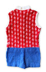 1960s vintage kids romper in red, white, and blue terrycloth with zip front and button details. Features figure print top and striped shorts - back.