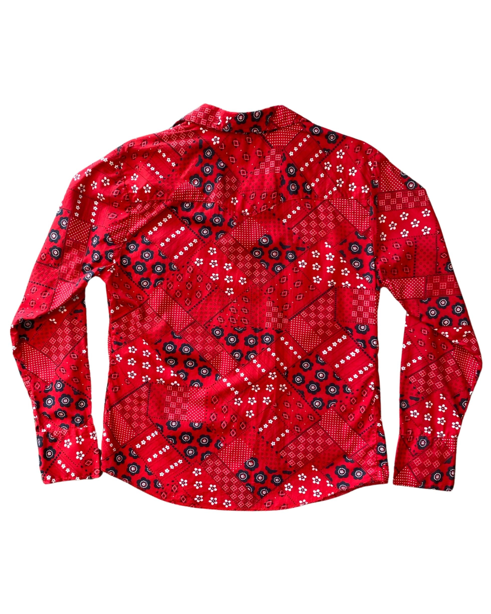  Vintage 1970s red bandana print snap shirt for women, made in USA with Western styling, back view.