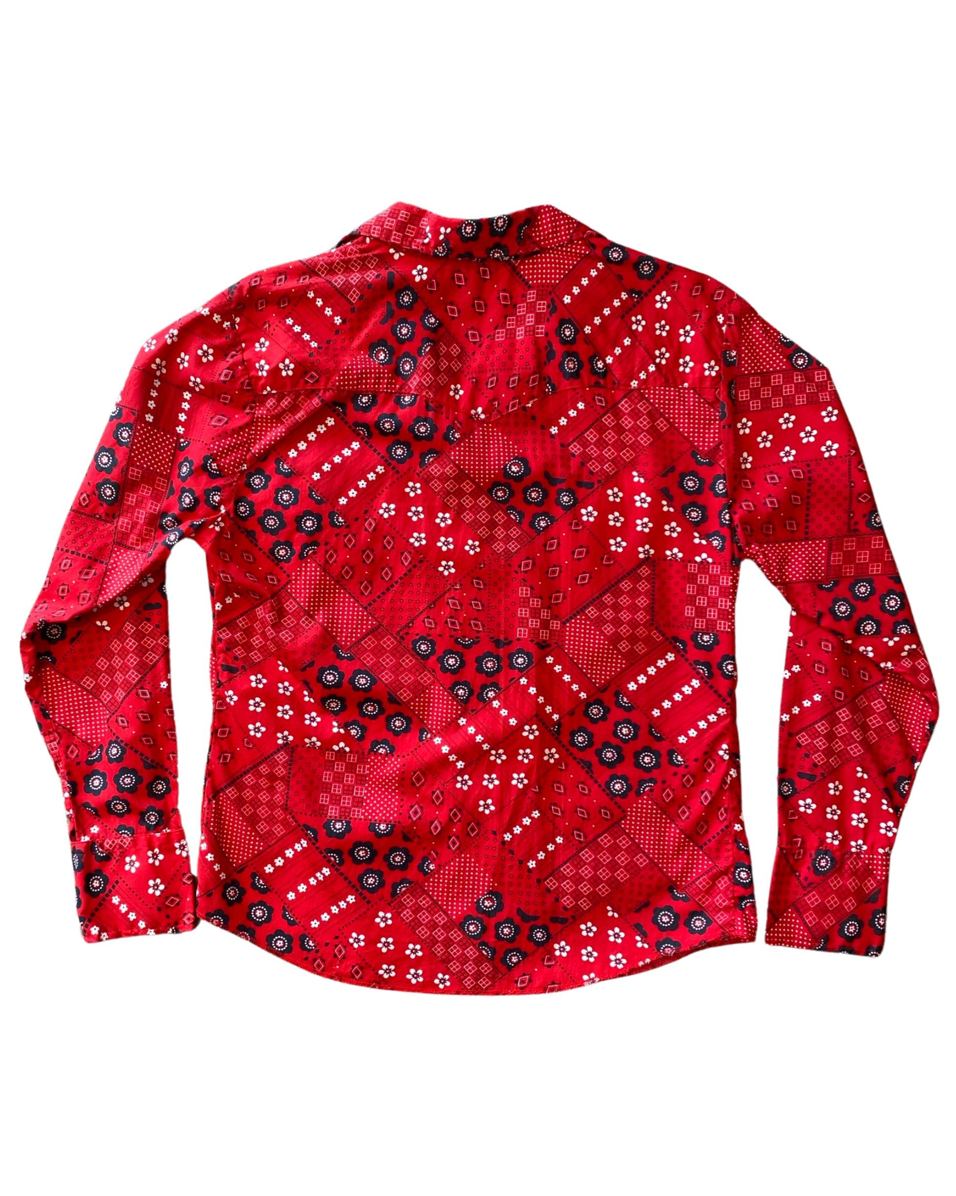  Vintage 1970s red bandana print snap shirt for women, made in USA with Western styling, back view.