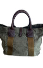 Vintage olive green canvas military tote with brown leather handles and webbing straps, interior zip pocket shown. Back.