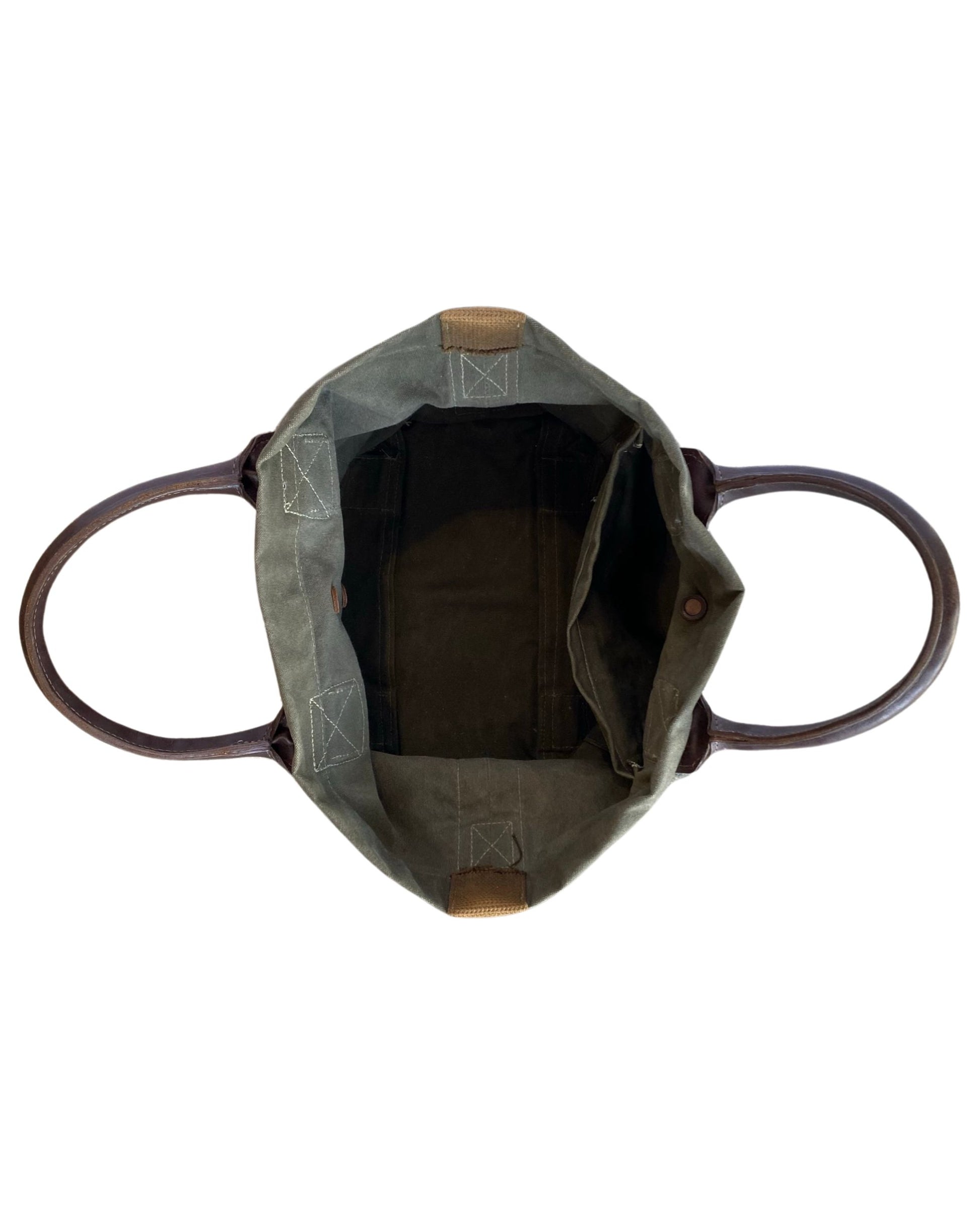 Vintage olive green canvas military tote with brown leather handles and webbing straps, interior zip pocket shown. Top down view.