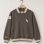 Front view of a mocha brown 100% cotton half-zip neighborhood sweatshirt with cream striped varsity ribbing, front pockets, an Old Californio-inspired chest monogram, and a felt 30 shoulder patch.