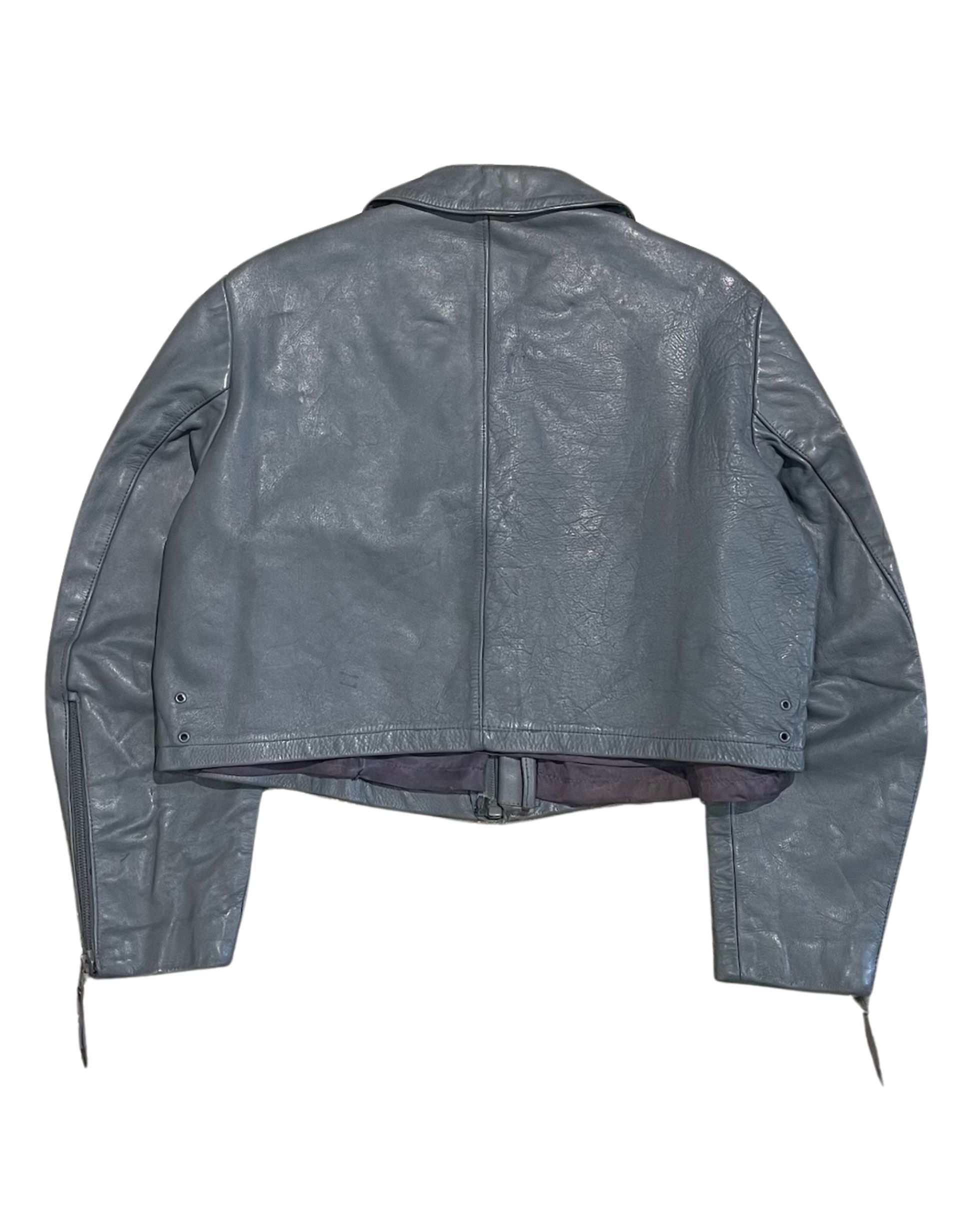 Back view of vintage grey leather jacket with cropped body and paneled construction.
