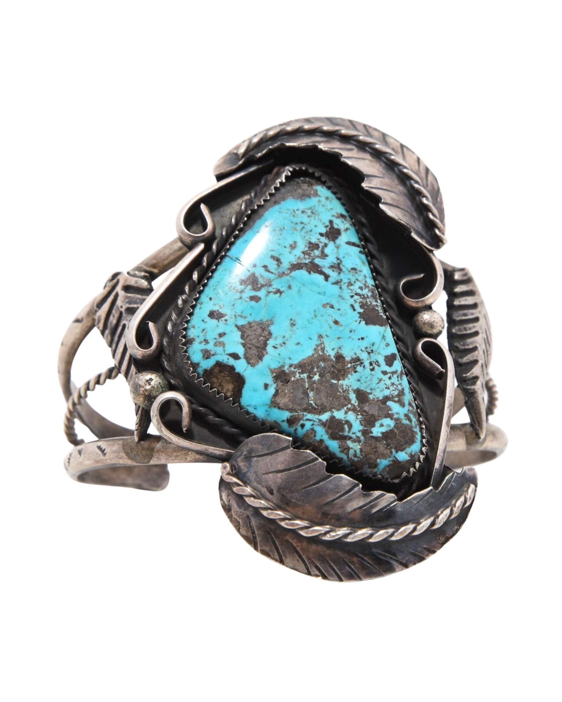 Vintage Navajo Sterling Silver Cuff with Triangular Turquoise Stone on white background.
