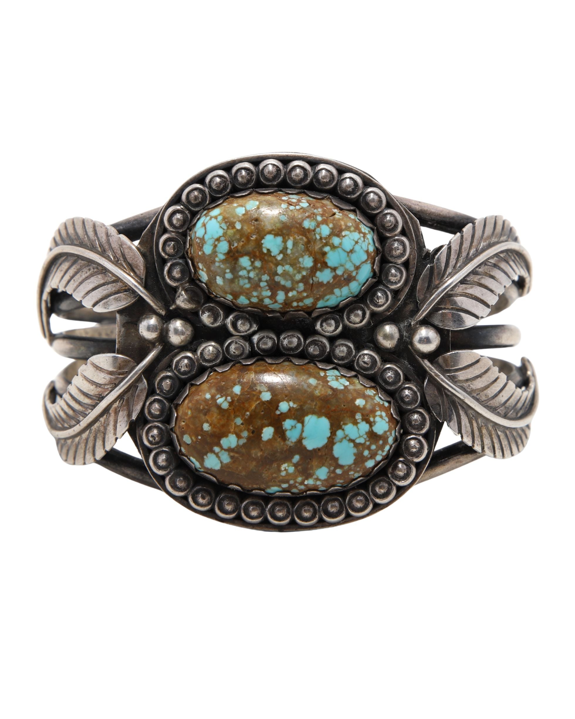 Front view of vintage Navajo cuff with turquoise and sterling silver.