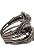 Detail of silver split-shank construction and oxidized patina.