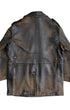 Back view of vintage Noël Cuir leather coat showing center seam, waist panel, and gunmetal rear adjusters with heavy patina.