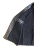 Interior right side detail showing Noël Cuir original label, leather detailing, and black wool lining.