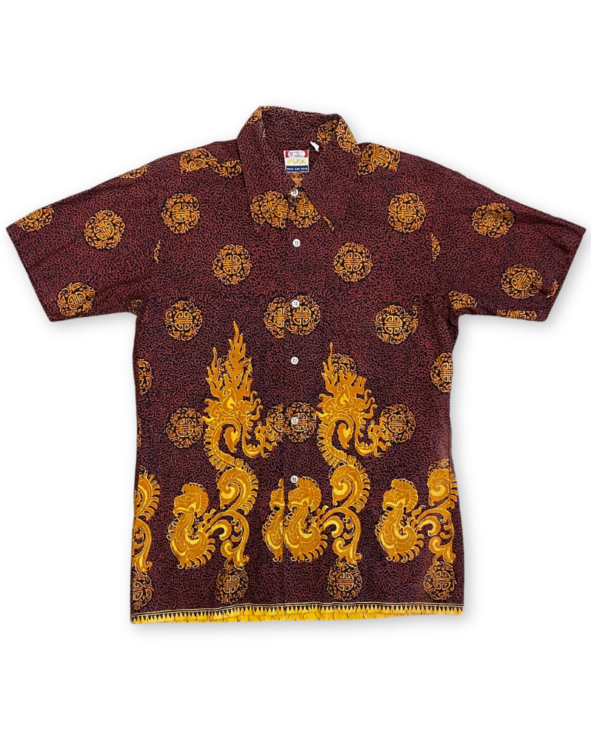 Front of vintage 1960s Kary’s of Penang Waikiki print shirt in maroon and gold with dragon border and medallion pattern.