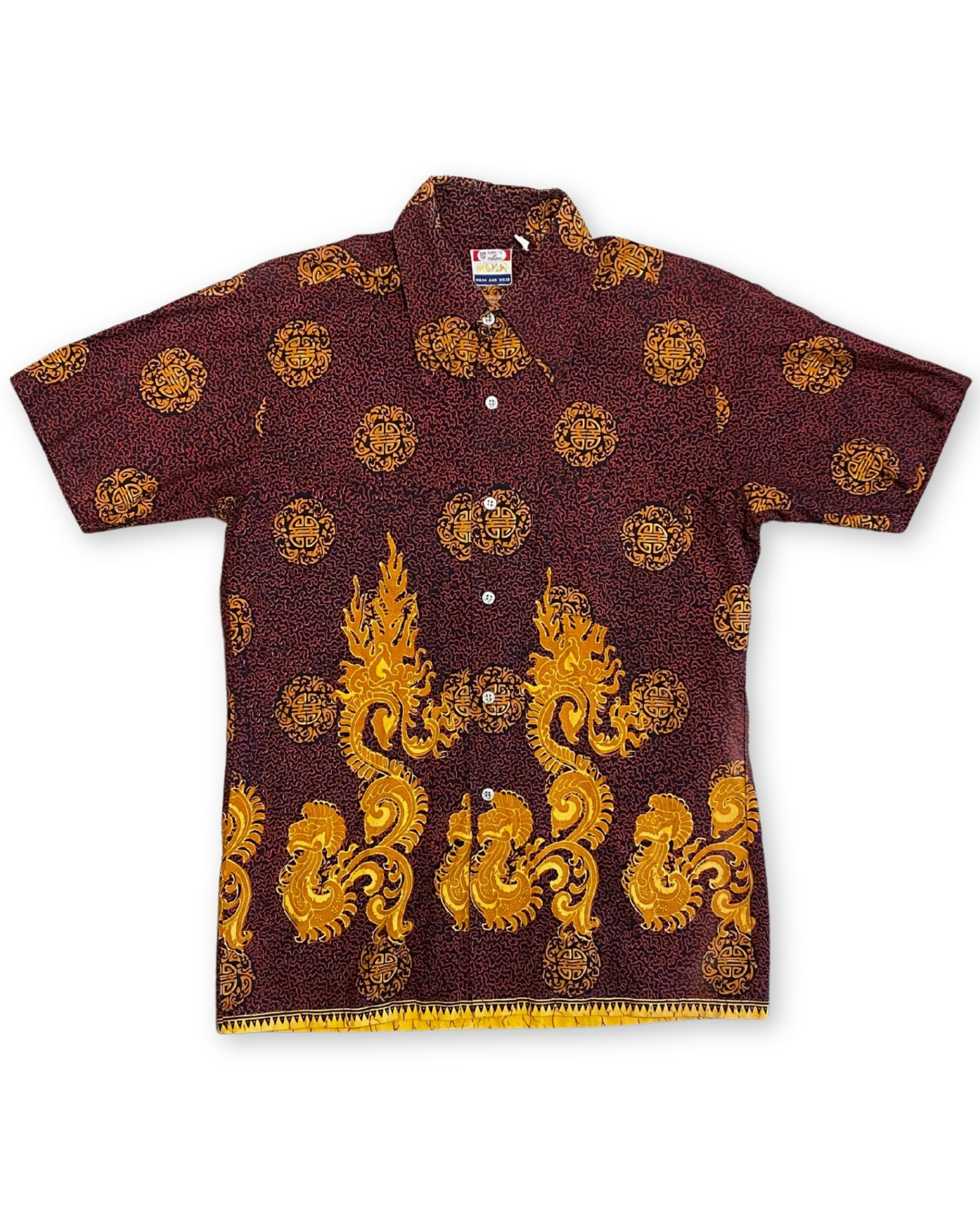 Front of vintage 1960s Kary’s of Penang Waikiki print shirt in maroon and gold with dragon border and medallion pattern.