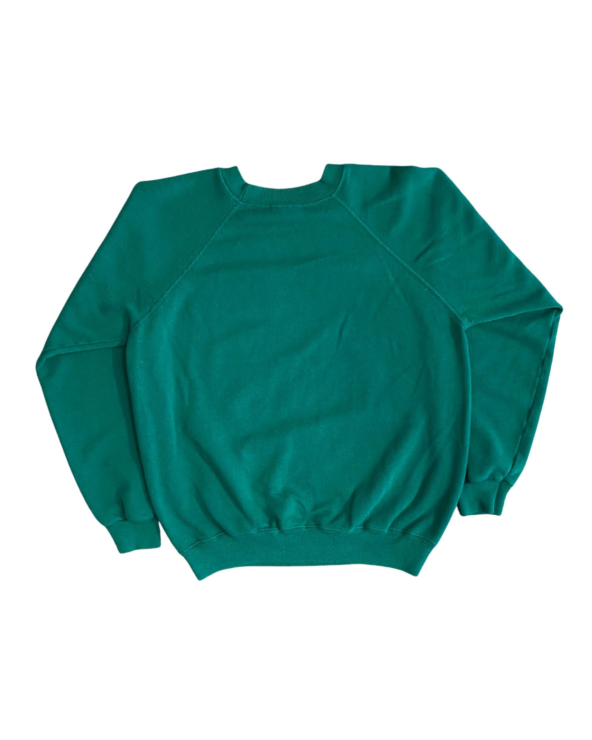 Back view of vintage 1980s 20th Century Fox green raglan crewneck sweatshirt, plain green with ribbed cuffs and waistband, on white background.
