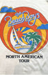 Close-up of 1982 Beach Boys North American Tour graphic showing sunset circle design with sailboat, palm tree, script logo, and Brother Records Inc. copyright.