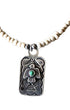 Detail view of vintage Fred Harvey Thunderbird pendant with turquoise on newly strung ceramic bead necklace.