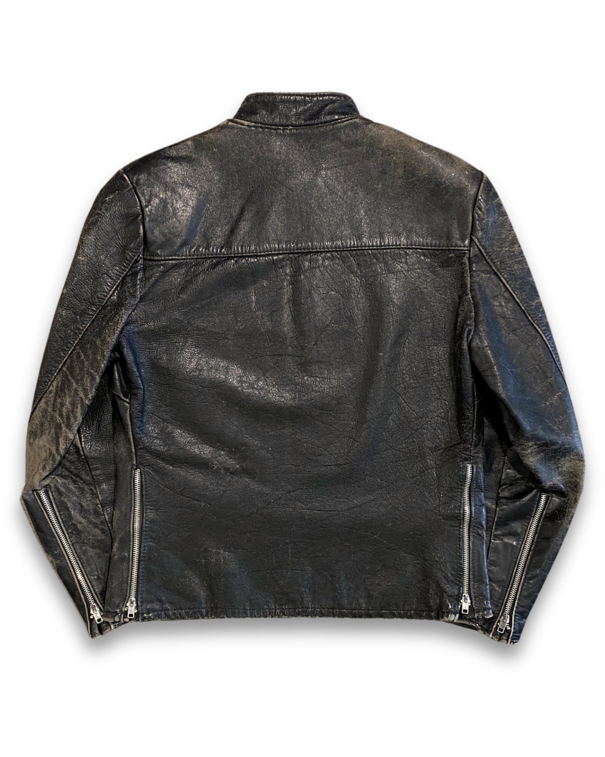 Back view of vintage 1960s black steerhide leather café racer jacket showing natural wear and aged leather patina.