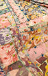 Close-up of vintage silk patchwork quilt with colorful embroidery.
Detail of chenille-tufted fabric patches on mid-century textile.
