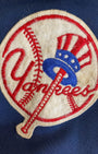 Felt and embroidered Yankees baseball patch on sleeve.