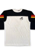 Long-sleeve shirt with black sleeves and white body, featuring a logo on the chest against a white background.
