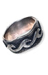 Sterling silver ring with raised scrollwork design and darkened recessed background.