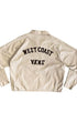 Back view of vintage jacket with black chainstitched “West Coast Vans” lettering.