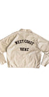 Back view of vintage jacket with black chainstitched “West Coast Vans” lettering.