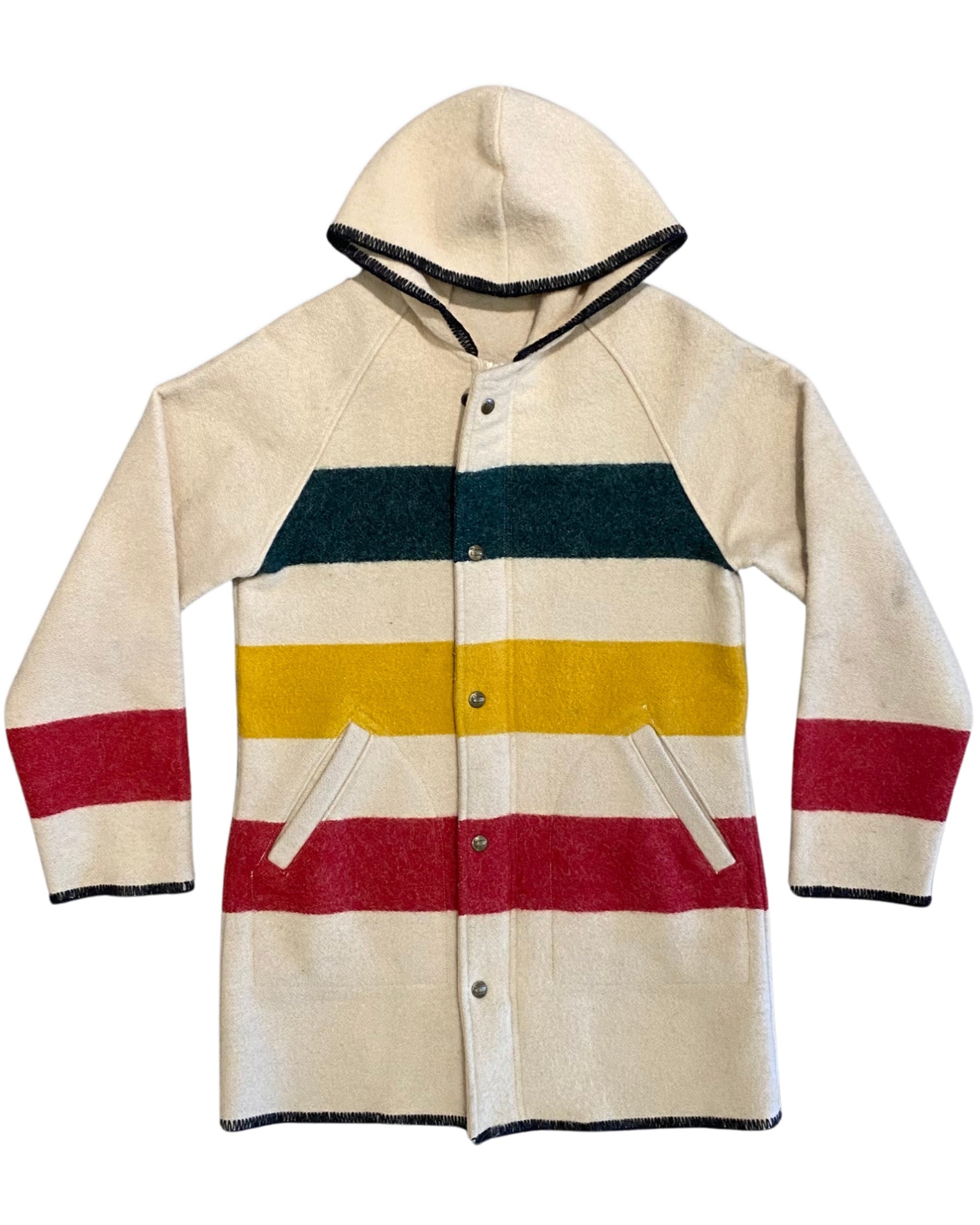 Front view of a cream Woolrich Woman hooded wool coat with green, yellow, and red stripes, snap closures, and angled pockets.