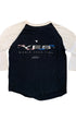Back view of a black and white three-quarter sleeve YES baseball T-shirt with YES World Tour 1984 and Sparkomatic Car Sound graphics.