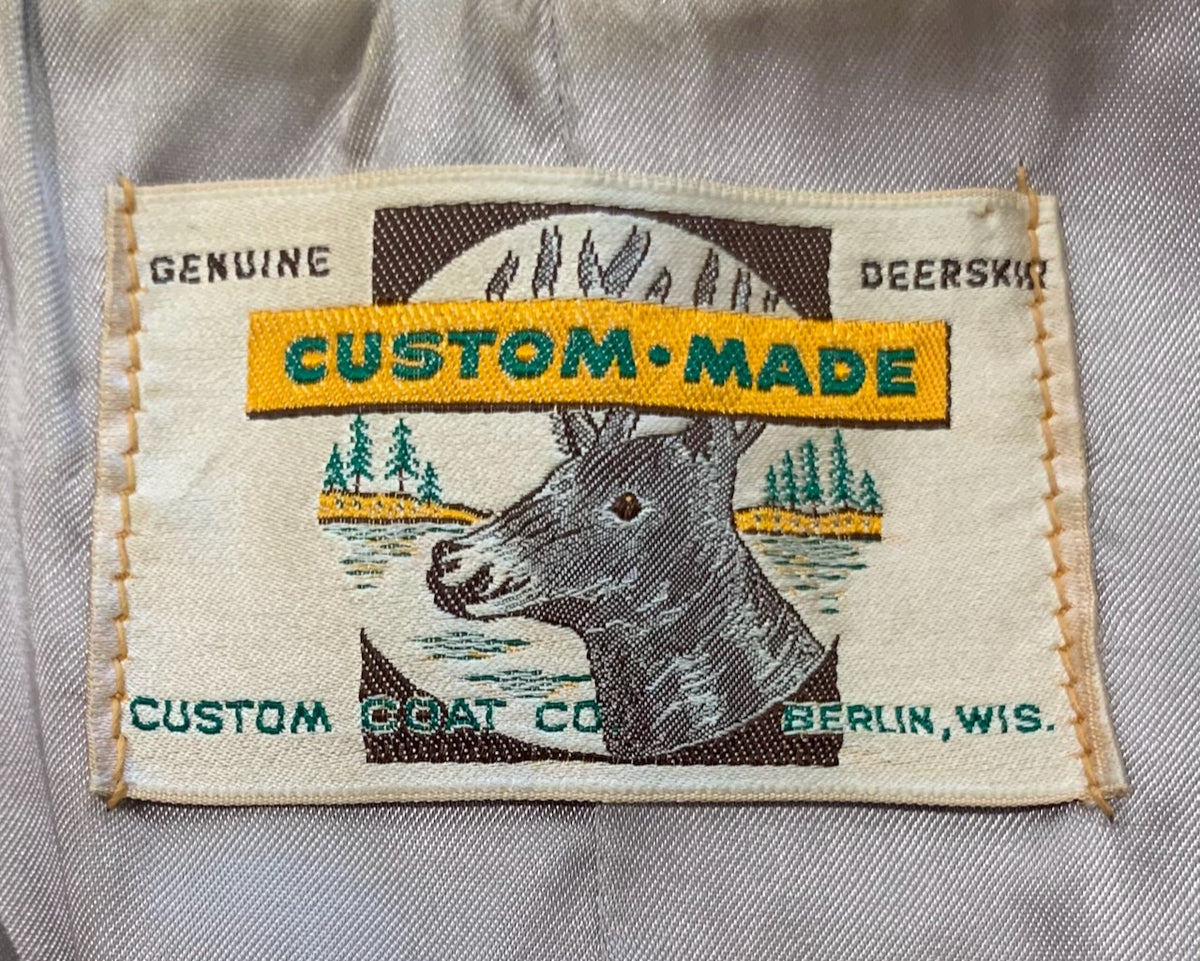Close-up of a Genuine Deerskin Custom-Made Custom Coat Co. Berlin, Wisconsin woven label.