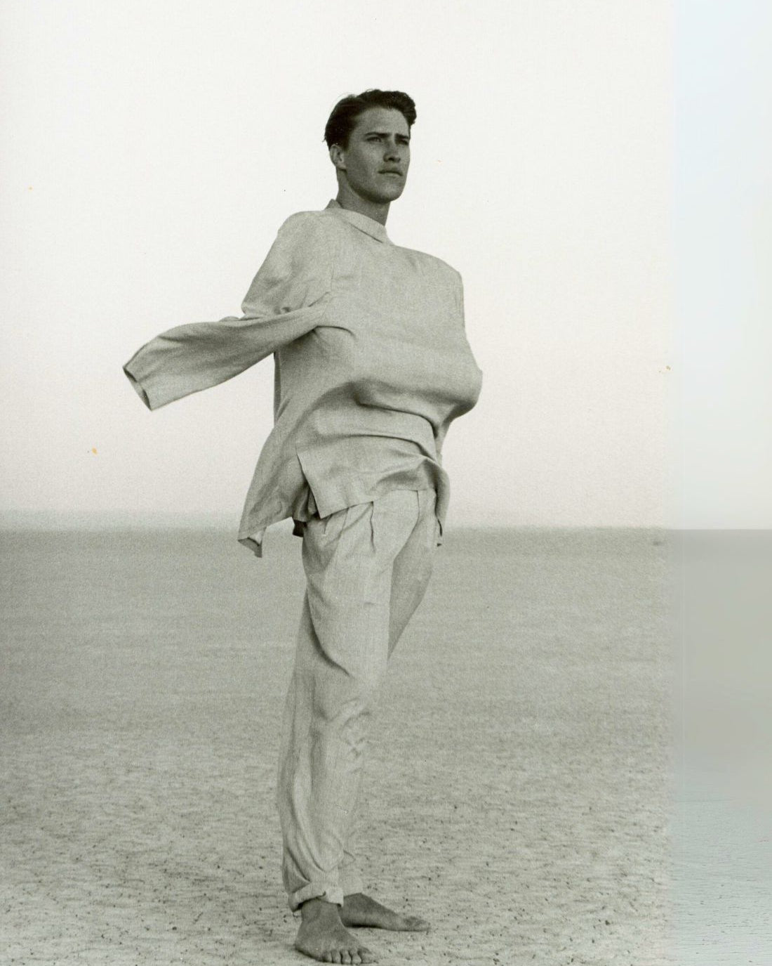 Man Posed With Blowing Jacket With Arms Tucked In