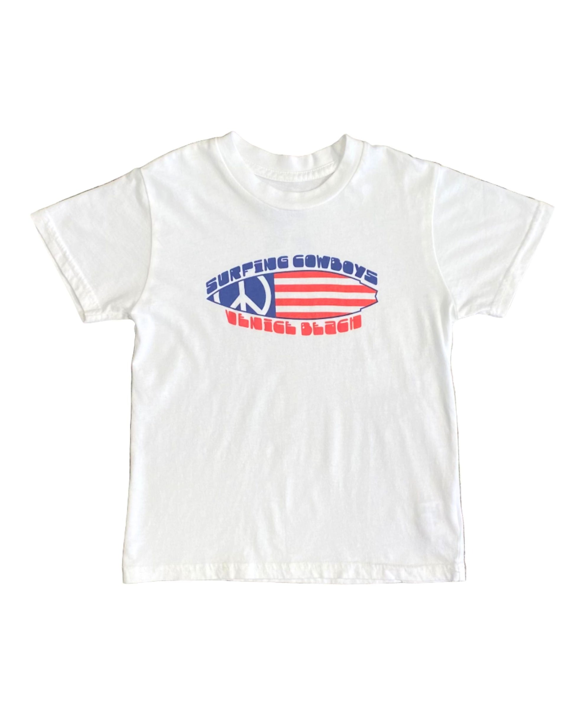 Toddler-size white T-shirt with Surfing Cowboys red, white, and blue peace flag surfboard graphic on front.