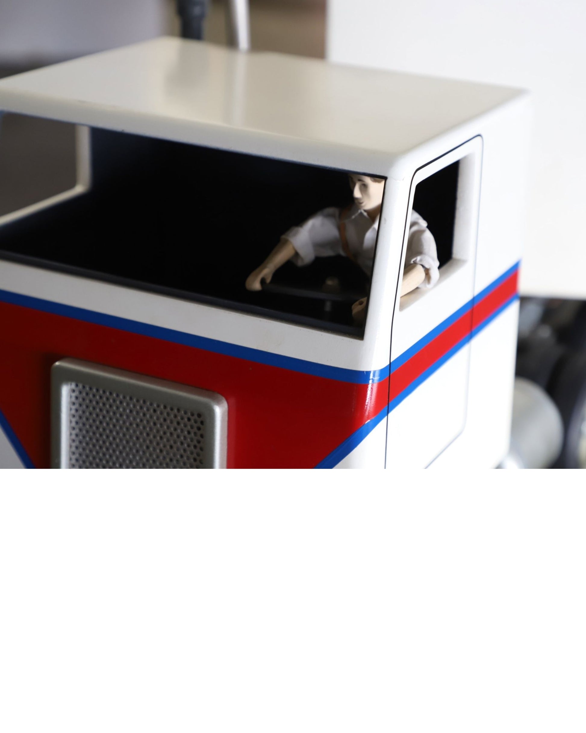 Handcrafted 1970s semi-truck model with wood body, metal parts, and rubber tires.