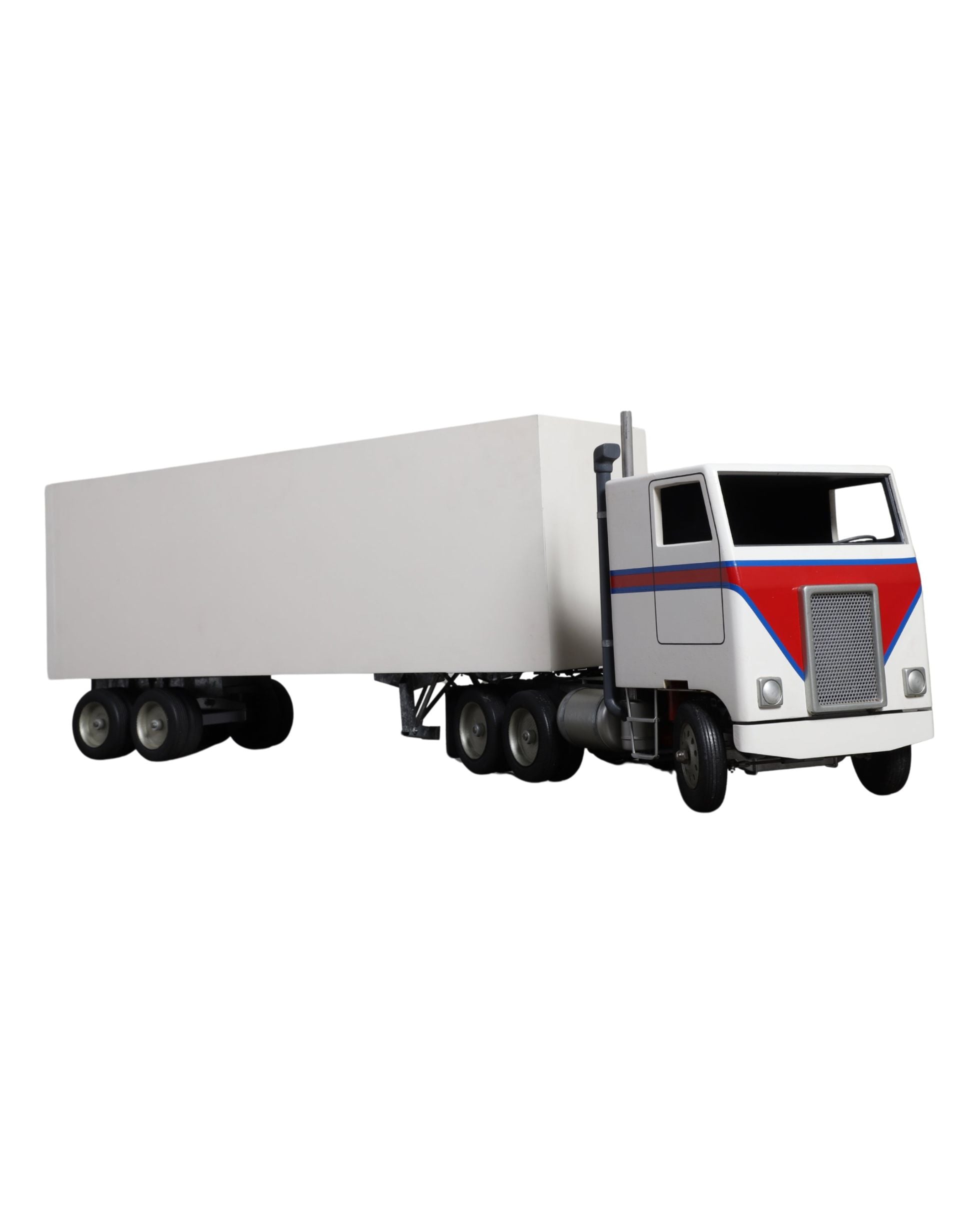 Handcrafted 1970s semi-truck model with wood body, metal parts, and rubber tires.