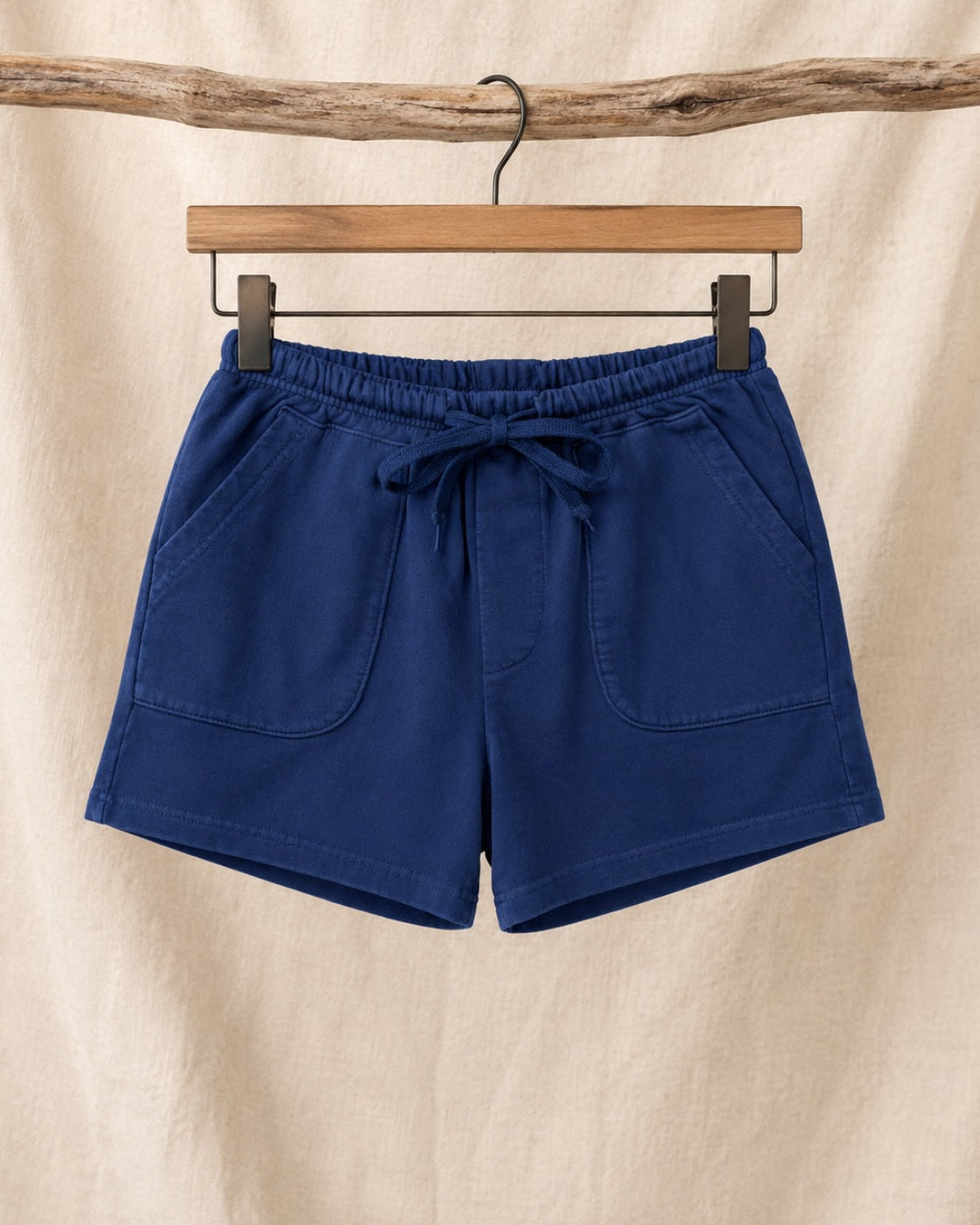 Front view of Surfing Cowboys Relaxed Shorts in Washed Navy loopback cotton with drawstring waist and patch pockets.