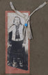 Detail of 19th-century photographic portrait showing an unidentified Native American adult in traditional dress.